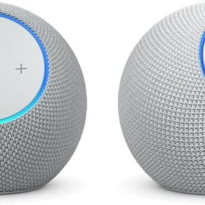 Echo Studio and Echo Dot Max smart speakers placed on a wooden table showing size dimensions comparison.
