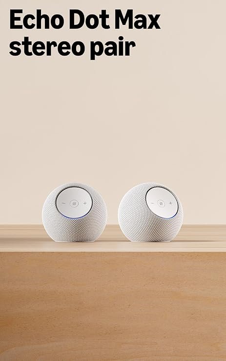 Echo Studio and Echo Dot Max smart speakers placed on a wooden table showing size dimensions comparison.